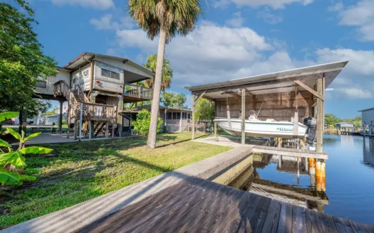 Canal Front Home For Sale in Suwannee, FL