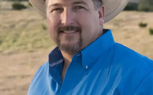 agent profile picture for Trey Garrett on log homes website