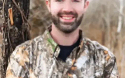 agent profile picture for Coltyn Bettis on log homes website