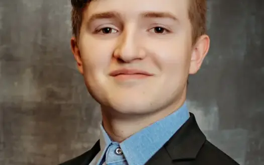 agent profile picture for Dylan Jones on log homes website