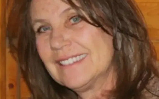 agent profile picture for Mary Douglas on log homes website