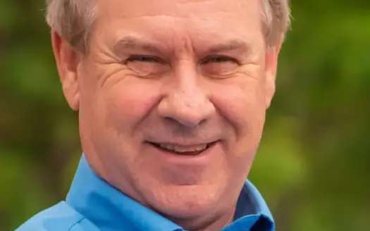 agent profile picture for Greg Manry on log homes website