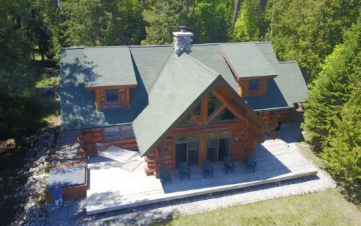 Water front log home living. Beautiful Lake Huron Bay views.