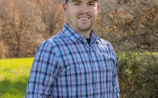 agent profile picture for Ryan Ammons on log homes website