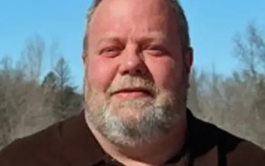 agent profile picture for Tim Possin on log homes website