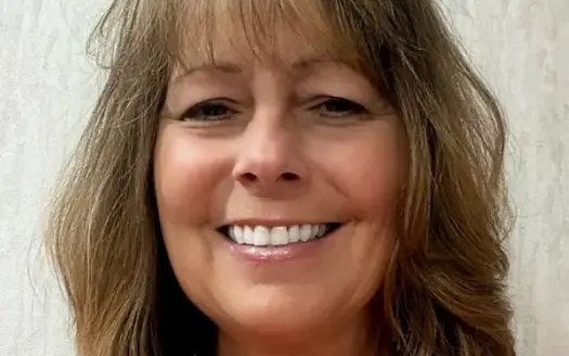 agent profile picture for Natalie Mlaskoch on log homes website