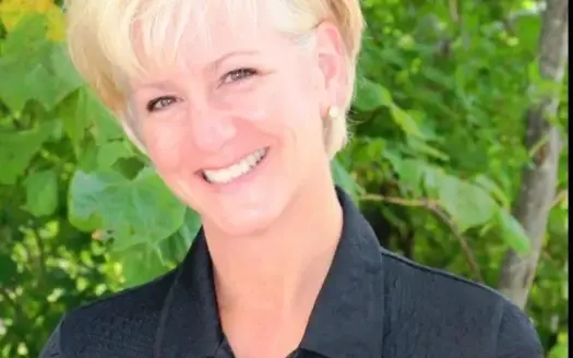 agent profile picture for Angie Schejbal on luxury homes website