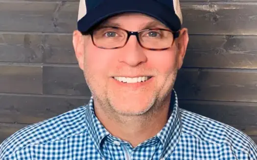 agent profile picture for Sam Stout on luxury homes website
